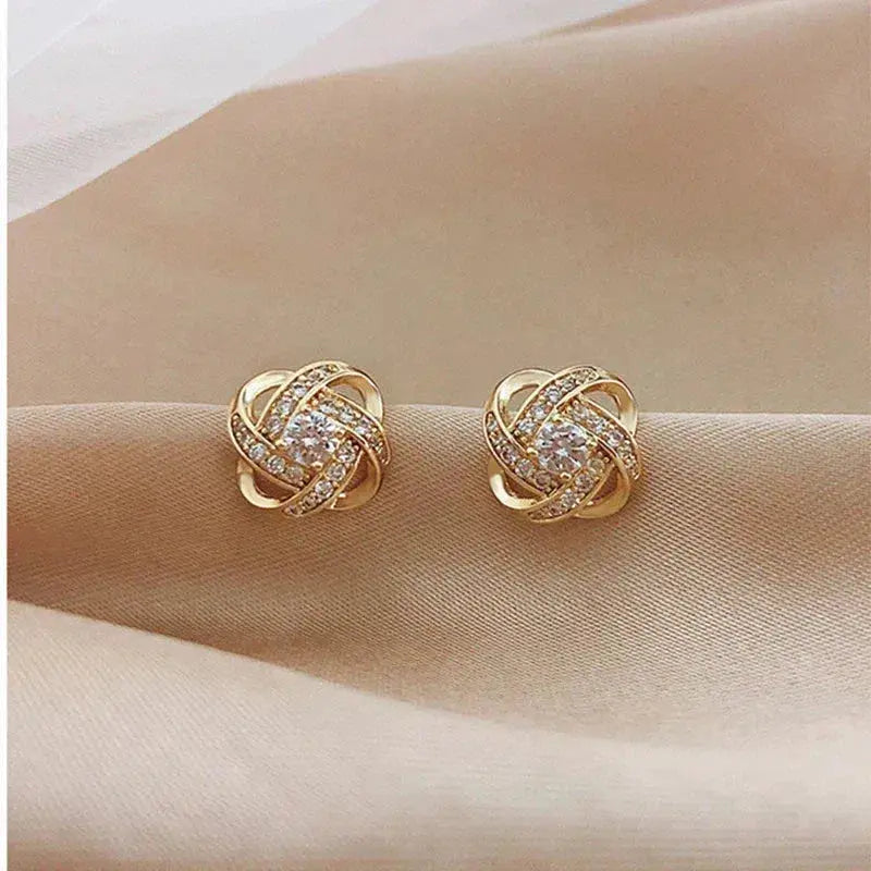 Boucles d'oreilles en croix florale spirale
