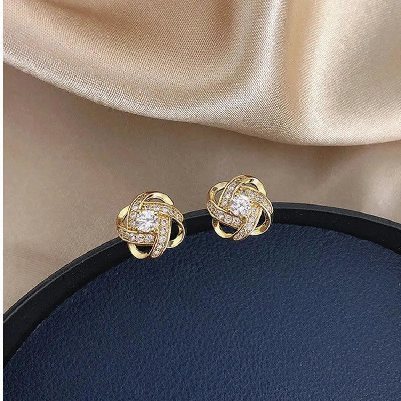 Boucles d'oreilles en croix florale spirale
