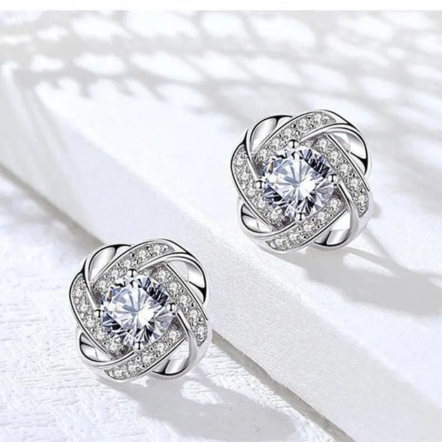 Boucles d'oreilles en croix florale spirale