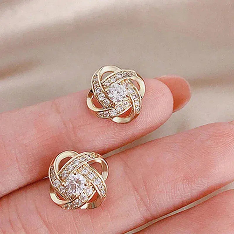Boucles d'oreilles en croix florale spirale