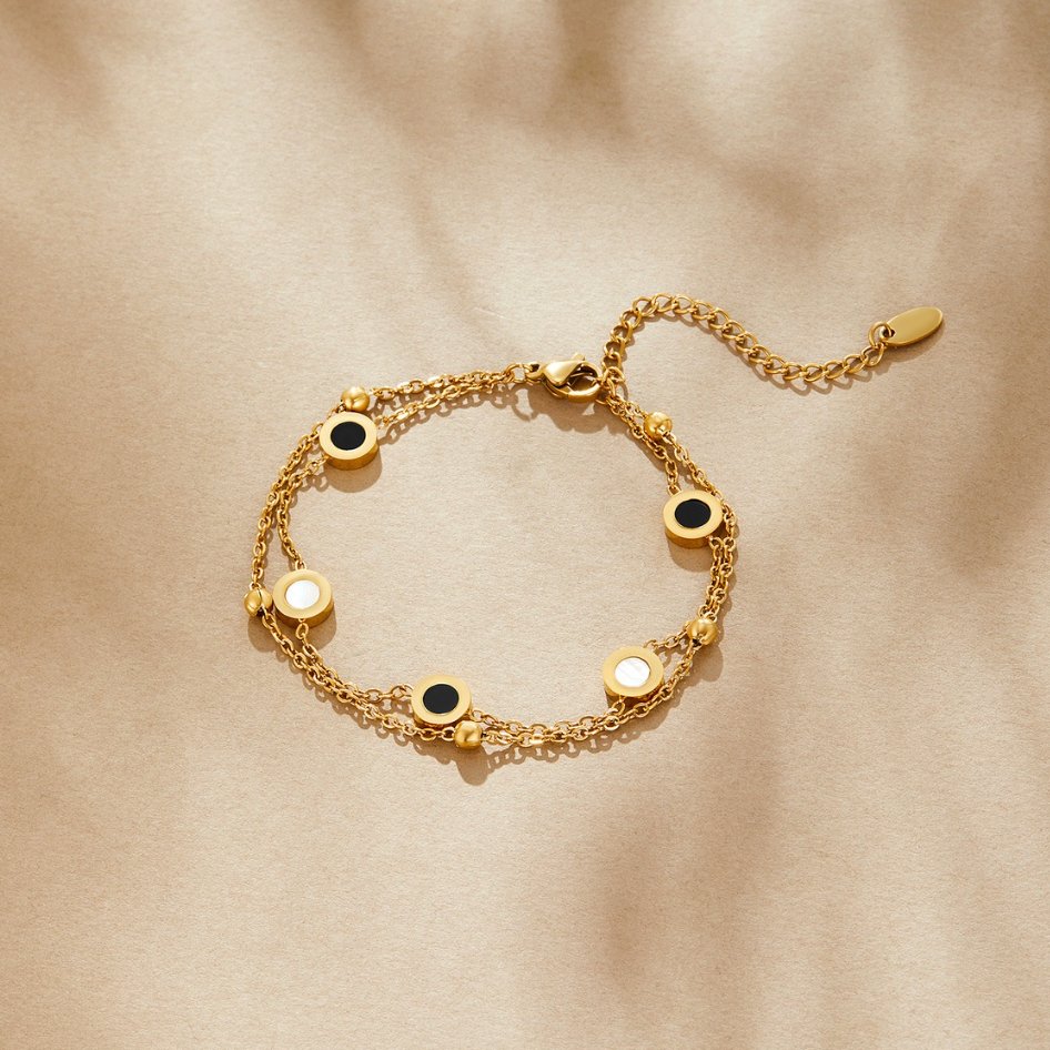 Bracelet en onyx et pierre blanche